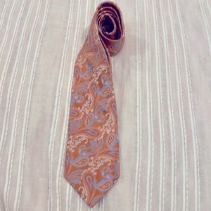 Men’s tie - orange paisley with blue accents.